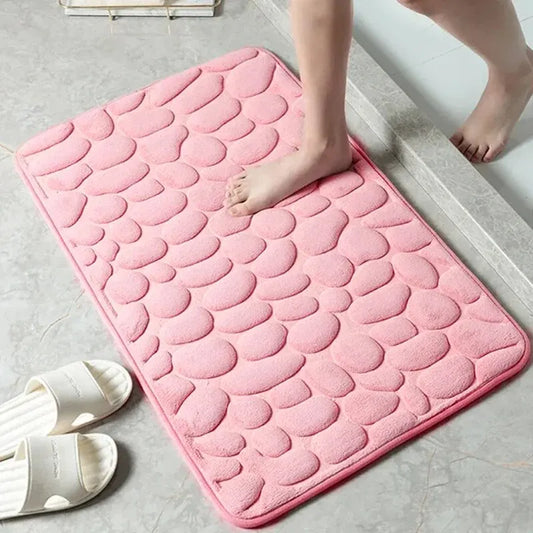 GLOBGRIP anti slip pebble floor mat in pink with textured pebble design on bathroom floor