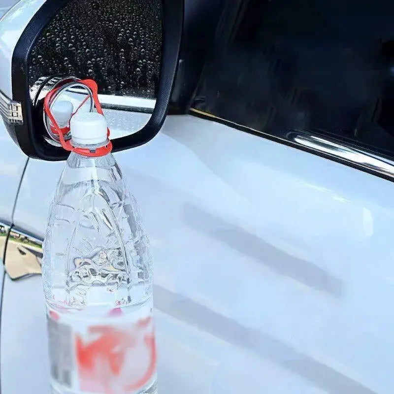GLOBGRIP bottle holder attached to car side mirror holding a plastic water bottle securely