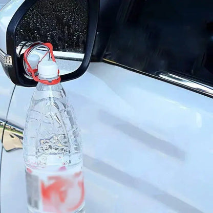 GLOBGRIP bottle holder attached to car side mirror holding a plastic water bottle securely