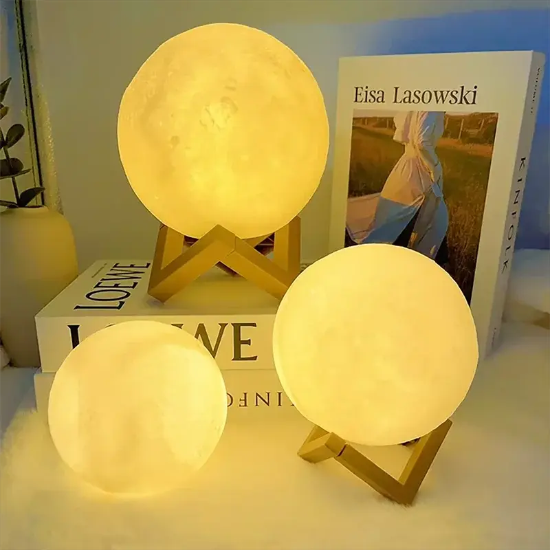 GLOBGRIP Book Light LED Moon Galaxy Night Light with wooden stands illuminated in warm yellow light