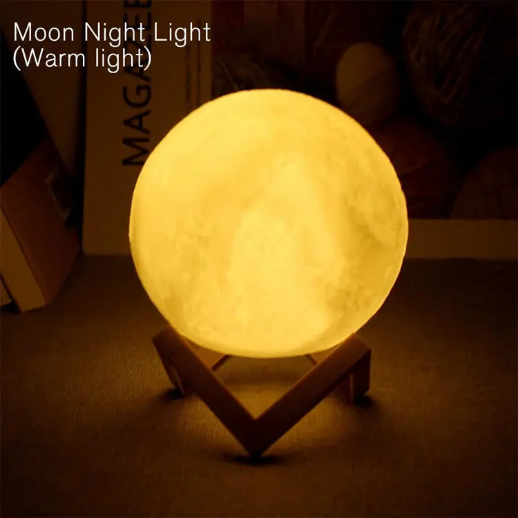 GLOBGRIP Book Light LED Moon Galaxy Night Light emitting warm yellow glow on wooden stand