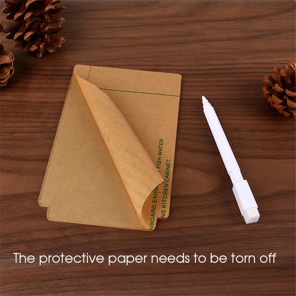 Writeable LED desk lamp accessory showing protective paper and white marker on wooden surface